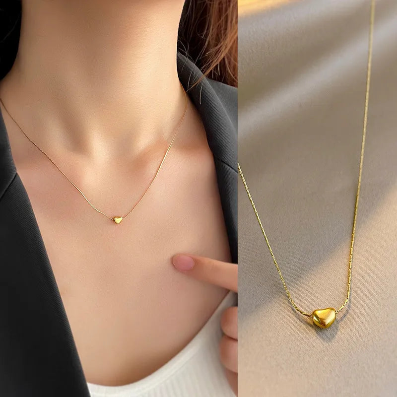 Gold-tone small heart pendant necklace, supplier SKU NH53768673