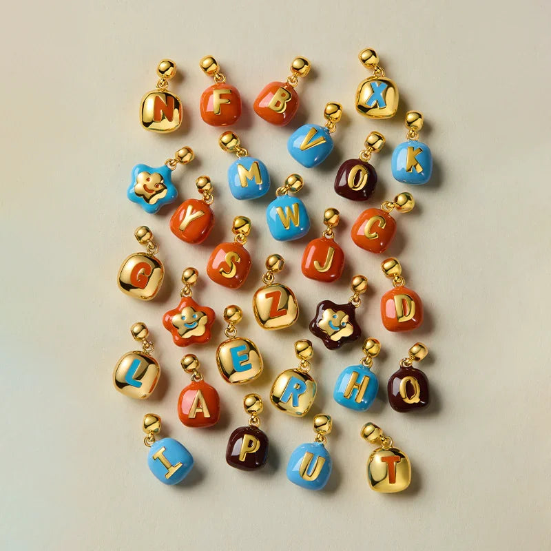 Sculpted Letter Charm — product and styling view 2